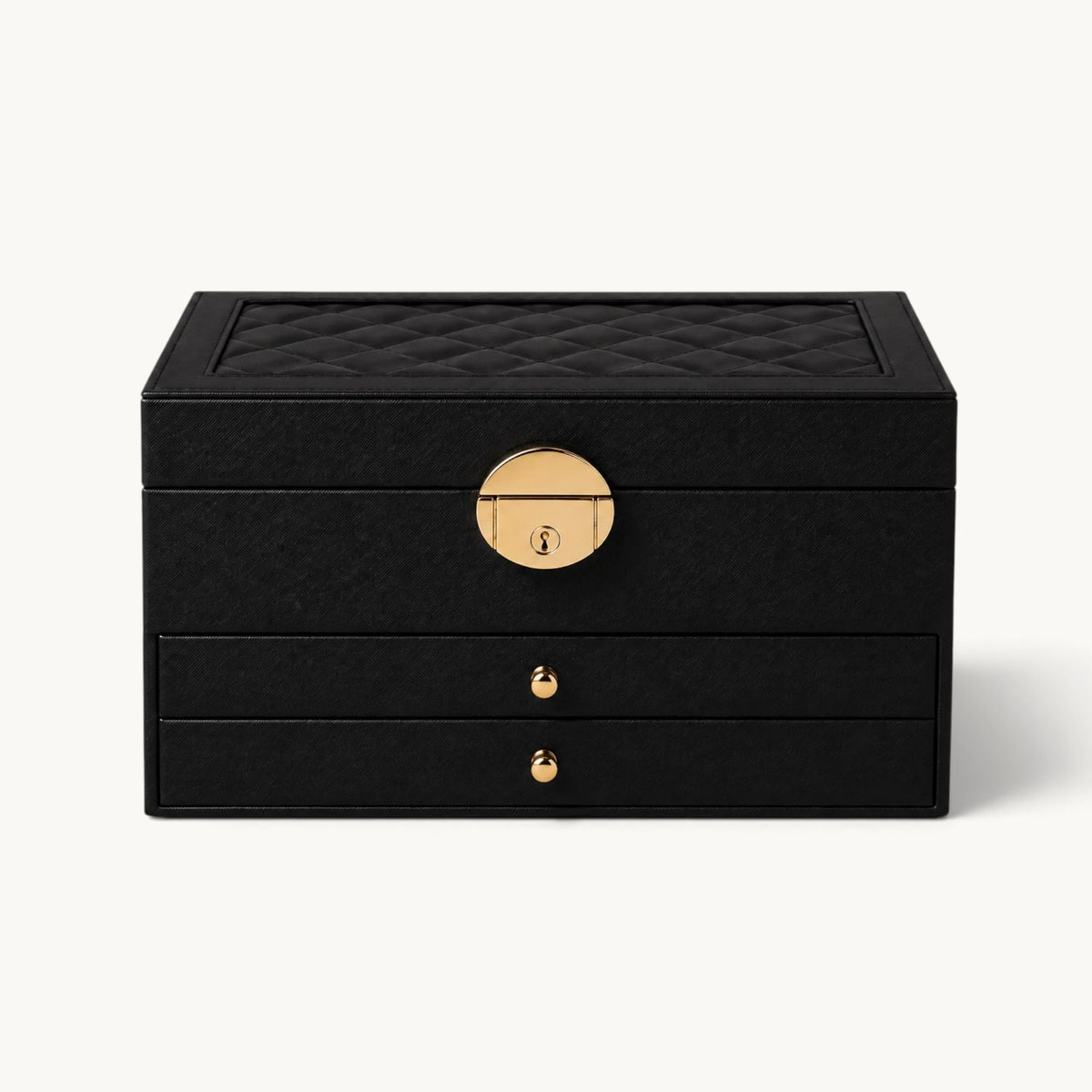 Grande boîte à bijoux noire fermée, couvercle matelassé et fermoir doré à serrure