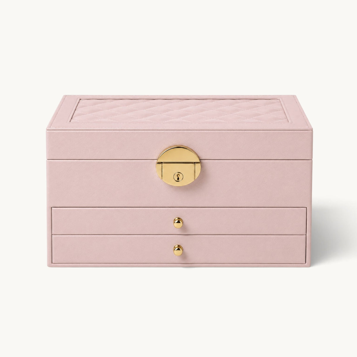 Grande boîte à bijoux rose fermée, couvercle matelassé et fermoir doré à serrure