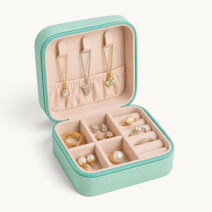 Petite boîte à bijoux de voyage ouverte vert menthe avec rangements