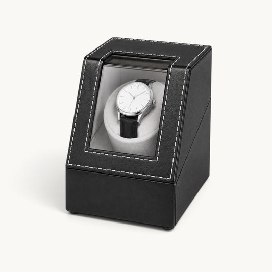 Remontoir montre automatique noir fermé, vitrine transparente et montre visible à l'intérieur